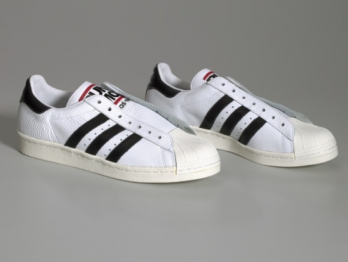 Pair of white and black Run-D.M.C. Superstar 80s sneakers made by Adidas