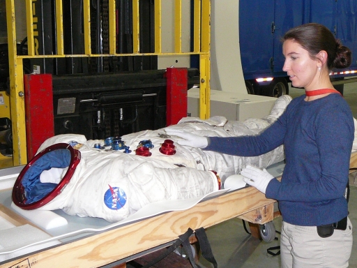 Samantha working with an Apollo 17 suit.