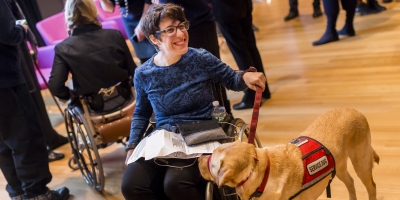 participant with service dog at Cooper Hewitt Lab: Design Access symposium photo by Scott Rudd