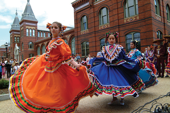 dancers in front of the Arts and Industries Building