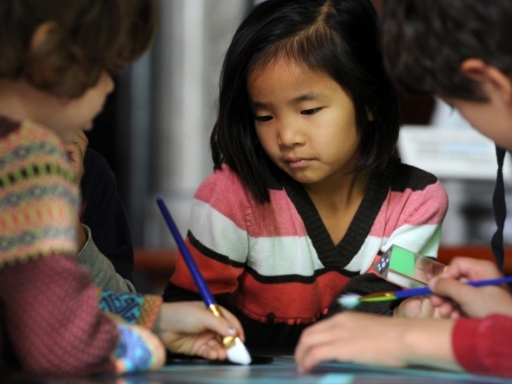 children with paint brushes